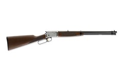 a black and brown rifle