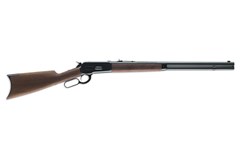 a brown and black rifle
