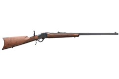 a brown rifle with a black handle with Springfield Armory in the background