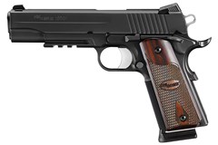 a black handgun with a brown handle with Springfield Armory in the background
