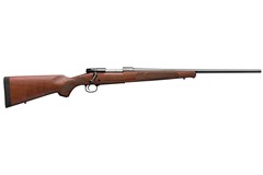 a brown rifle with a black handle