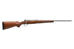 a brown rifle with a long handle with Springfield Armory in the background